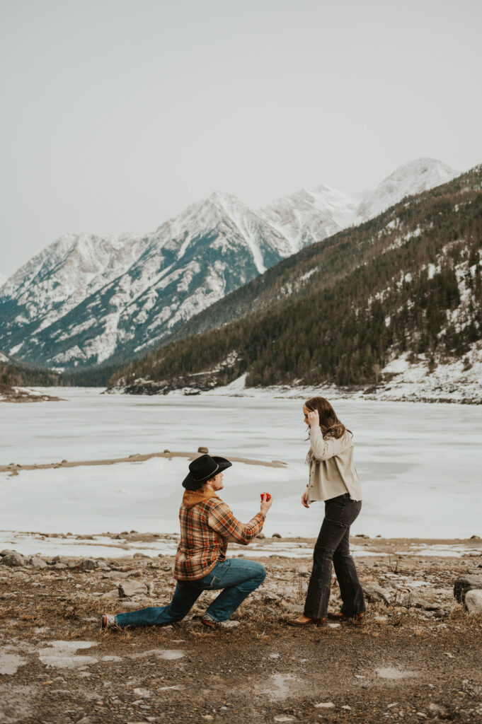 Surprise Montana Proposal in Northwest Montana | Western Engagement Outfit Inspiration | Western Photographer| Snowy Mountain Proposal |