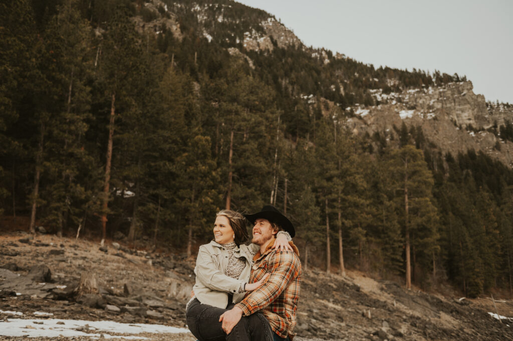 Surprise Montana Proposal in Northwest Montana | Western Engagement Outfit Inspiration | Western Photographer| Snowy Mountain Proposal | Engagement ring | Ranch Water | Montana Brewing Company |